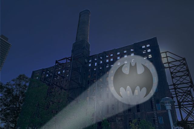 The Bat Signal projected on to the old Domino Sugar refinery